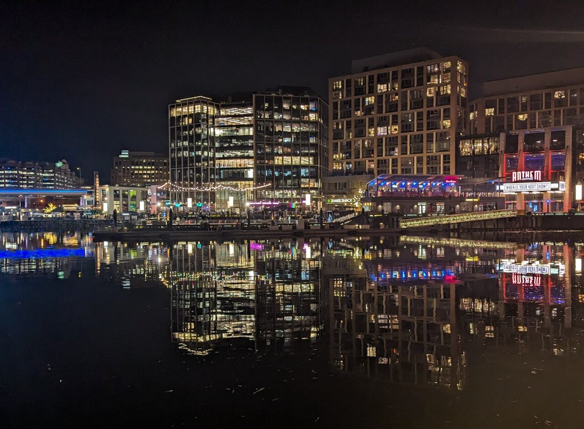 The Wharf waterfront promenade in Washington DC lit up at night
